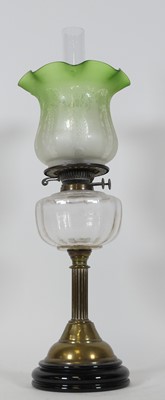 Lot 126 - A Victorian brass oil lamp, having an acid...