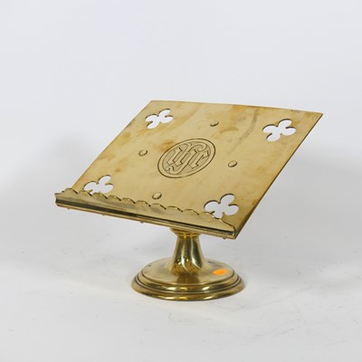 Lot 127 - A Victorian brass bookstand, having pierced...