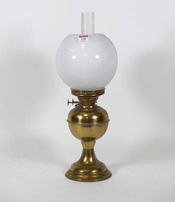 Lot 130 - A Victorian brass oil lamp, having a milk...