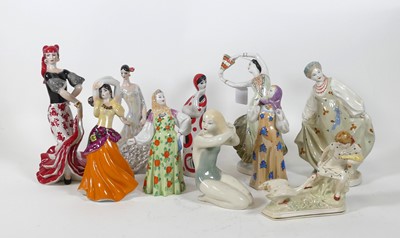 Lot 155 - A collection of Soviet porcelain figures, to...