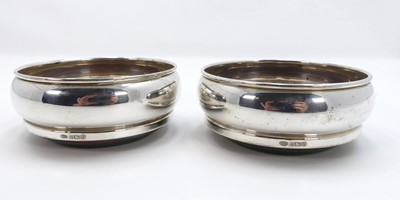 Lot 260 - A pair of modern silver bottle coasters, each...