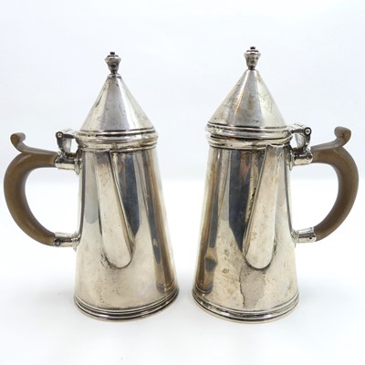 Lot 257 - A pair of George V silver chocolate pots, each...