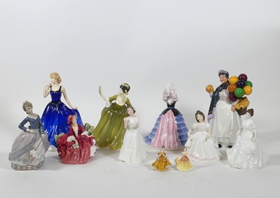 Lot 167 - A collection of porcelain figures to include...