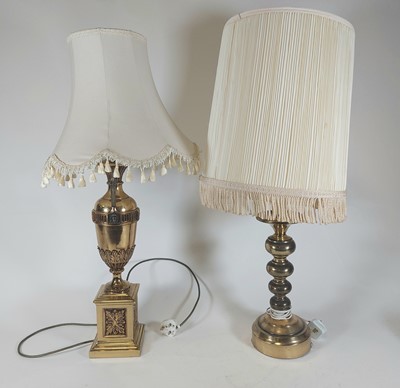 Lot 168 - A polished brass table lamp in the form of...