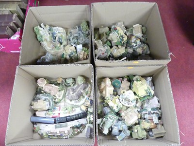 Lot 184 - A collection of resin model cottages to...