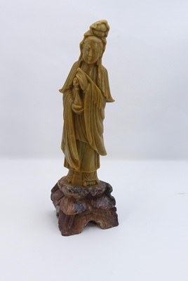 Lot 248 - A Chinese carved soapstone figure, height 25cm