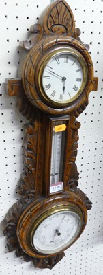 Lot 1148 - A circa 1900 carved oak banjo clock barometer,...