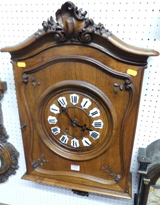 Lot 1149 - A French walnut cased wall clock, h.74cm