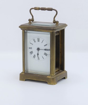 Lot 543 - A lacquered brass clad carriage clock, having...