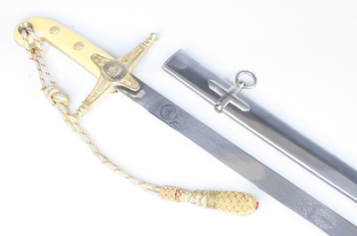 Lot 585 - A Malaysian mameluke presentation sword, the...