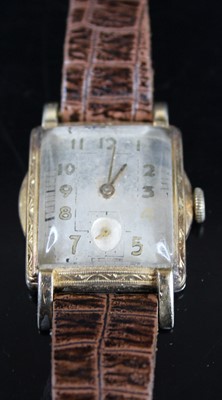 Lot 355 - An Art Deco gold plated tank wristwatch,...