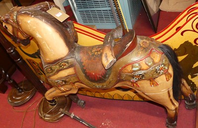 Lot 1188 - A painted carved wood fairground carousel...