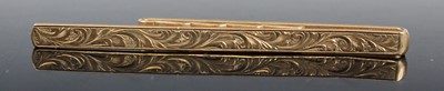 Lot 360 - A 9ct gold and engraved money clip, sponsor...