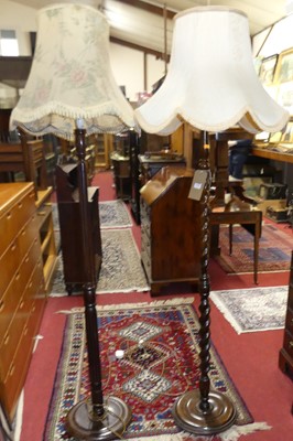 Lot 1190 - Two turned and stained beech standard lamps,...