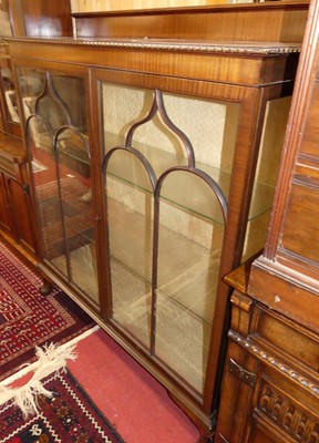 Lot 1195 - A 1930s mahogany ledgeback double door glazed...