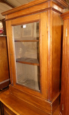 Lot 1197 - A small Edwardian walnut single door glazed...