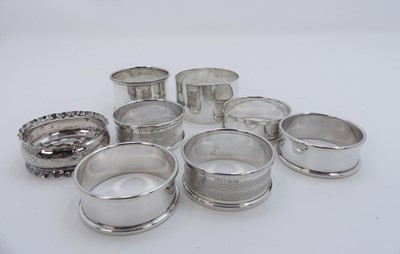 Lot 571a - A collection of silver napkin rings, gross...