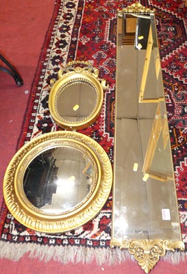 Lot 1217 - A bevelled pier mirror, with opposing floral...