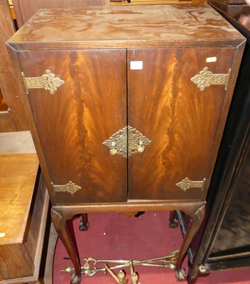 Lot 1226 - A figured walnut and floral pierced brass...