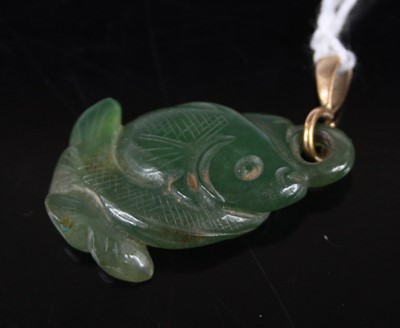 Lot 378 - A Chinese carved jade pendant as a fish,...