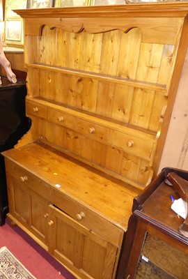 Lot 1232 - A modern stained pine kitchen dresser, width...