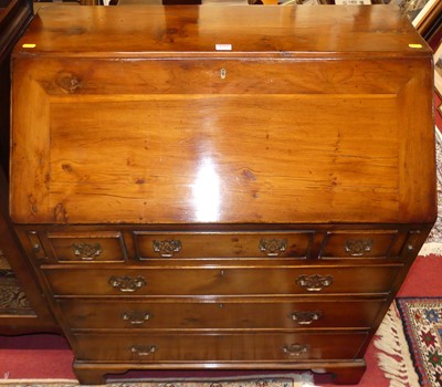 Lot 1235 - A contemporary yew slope front writing bureau,...