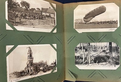 Lot 587 - An early 20th century postcard album and...