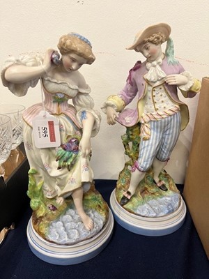 Lot 595 - A pair of French bisque porcelain figures of a...