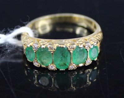 Lot 434 - A modern 18ct gold, emerald and diamond point...