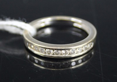 Lot 443 - A modern 9ct white gold diamond half-hoop ring,...