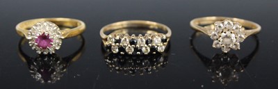 Lot 454 - A modern 9ct gold, blue and white sapphire set...