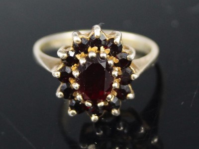 Lot 456 - A silver-gilt garnet set flower head cluster...