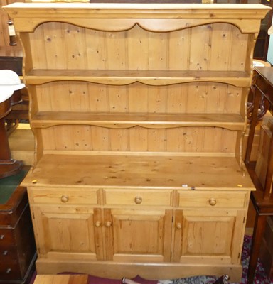 Lot 1286 - A modern pine kitchen dresser, having two-tier...