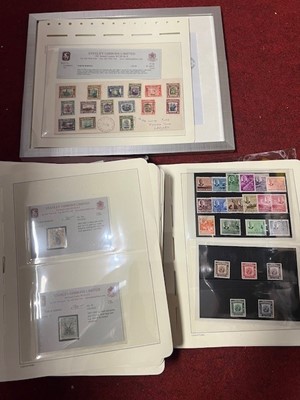 Lot 673 - A stamp album and loose paged examples