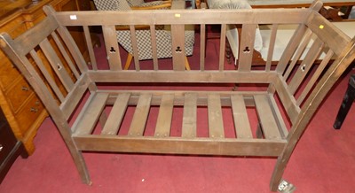 Lot 1351 - An Arts & Crafts beech slatback twin bench...