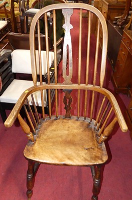 Lot 1425 - An elm, oak and beech Windsor chair, raised on...