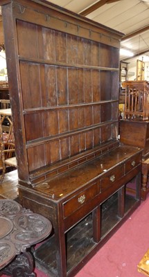 Lot 1390 - An 18th century oak kitchen dresser, having...