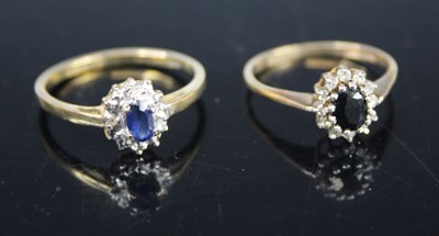 Lot 404 - A modern 9ct gold, blue and white sapphire...