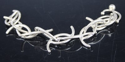 Lot 412 - A contemporary silver bracelet, 19cm, 36g