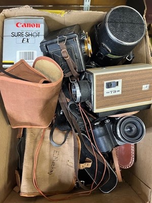 Lot 623 - A collection of vintage cameras and related...