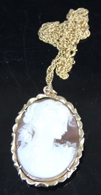 Lot 413 - A carved shell cameo brooch in 14ct gold mount,...