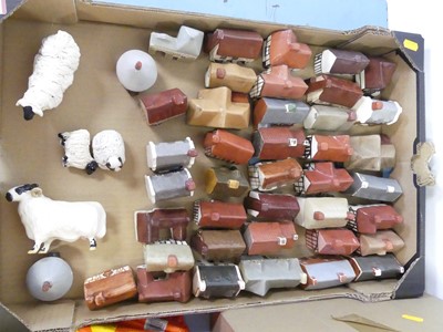 Lot 497 - A collection of ceramic model cottages,...