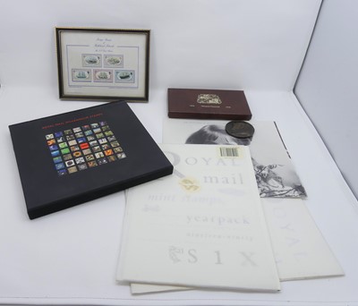 Lot 503 - A Royal Mail and Millennium stamp album...