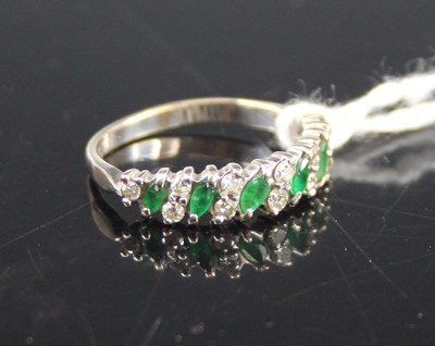 Lot 429 - A modern 18ct gold emerald and diamond...