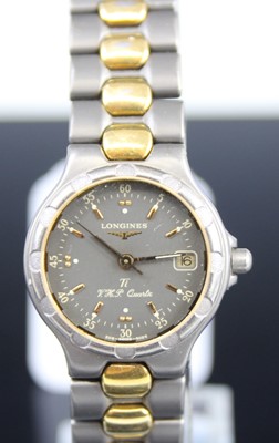 Lot 459 - A Longines lady's titanium cased and gold...