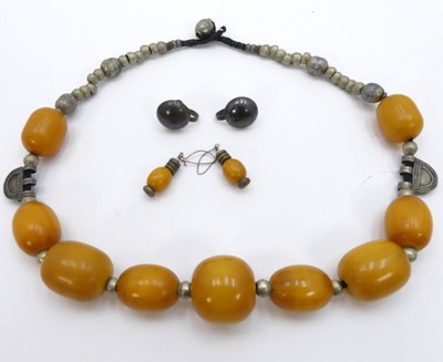 Lot 312 - A beaded faux amber necklace; together with a...