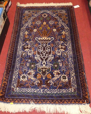 Lot 1176 - A near pair of Persian woollen blue ground...