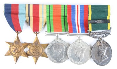 Lot 723 - A group of five medals to include WW II...