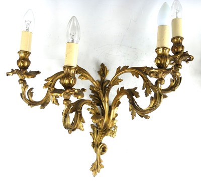 Lot 2420 - A pair of Rococo Revival gilt metal four-light...