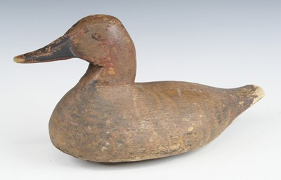 Lot 860 - An early 20th century carved pine decoy in the...